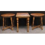 A pair of 20th century oak pub tables, circular tops, turned legs, X-stretcher, 73cm high, 67cm