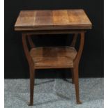 An unusual Aesthetic period oak fold-out occasional table, the rectangular top with twin-hinged