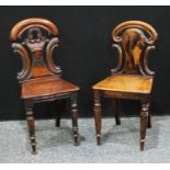 A William IV mahogany hall chair, carverd back, serpentine seat, turned legs, 85cm high; another