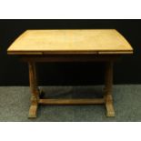 An oak refectory type draw-leaf dining table