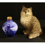 A Royal Doulton 'Blue Children' series vase, 13.5cm high; a Royal Doulton model of a cat, 21cm