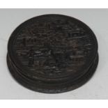 A 19th century Chinese tortoiseshell circular snuff box and cover, with scenes of traditional