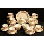 A Colclough Honeysuckle pattern tea set for twelve, including teapot, milk and sugar, bread and