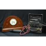 An Edwardian mahogany inlaid mantel clock, domed case, painted white enamel dial, Arabic numerals,