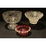 A cut glass pedestal bowl, panels with birds on branches; another, bowl on stand; a cranberry