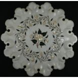 An Indian alabaster shaped circular table-top, inlaid in mother-of-pearl and coloured specimen