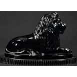 A John Derbyshire pressed glass model, of a recumbent lion, shaped oval base, 18cm wide,