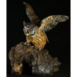 An Austrian cold painted bronze, of an owl, rustic wooden base, 13.5cm high, c.1900