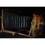 A late 19th/early 20th century lacquered brass and mahogany plate camera, Thornton Picard, Time &