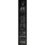 A Native American green soapstone carving, of a totem pole, 21cm high