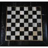 A marble and white onyx chess board, outlined with brass stringing, 25cm square