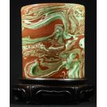 A Chinese earthenware bitong brush pot, the marbled glaze in tones of green and brown, 13.5cm