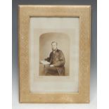 A large early 20th century tooled and gilt leather rectangular photograph frame, worked with bands