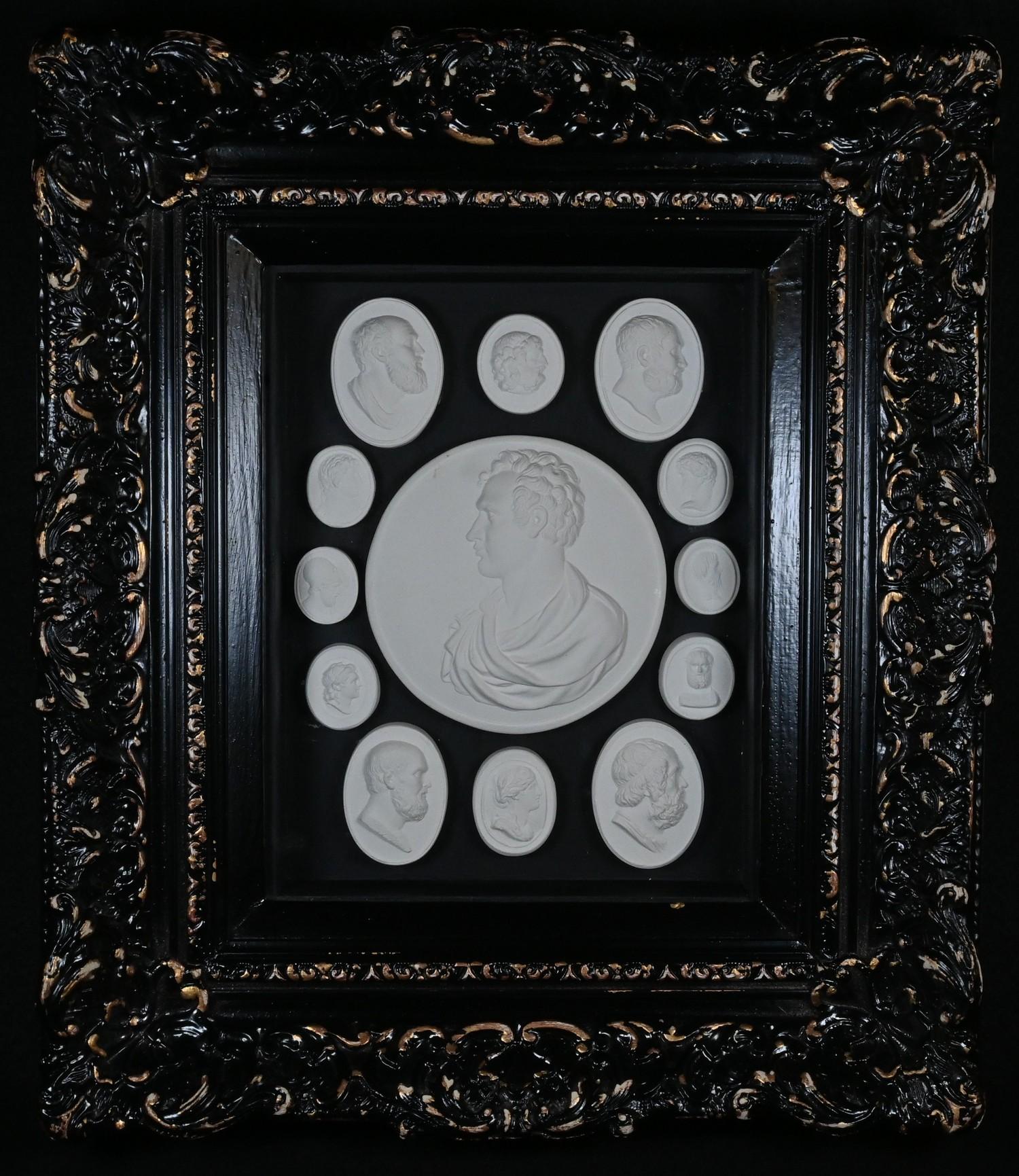 An arrangement of plaster intaglio impressions, various Grand Tour and Romantic figures, 19cm x