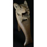 A Black Forest novelty lever-action nut cracker, carved as the head of a bear, 16cm long, c.1900