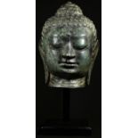 A Chinese sculpture, after an ancient bronze, head of Buddha, square plinth, 41cm high