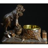 A Black Forest novelty table vesta, carved with a St Bernard dog, with provision for match box and