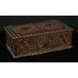 An 18th century chip-carved rectangular six plank table-top box, decorated throughout with