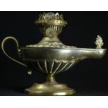 An Edwardian brass study oil lamp, in the Neo-Classical taste as a Roman lamp, embossed with batwing