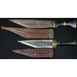 A Somali billao dagger, 16.5cm blade, hardwood grip, tooled leather scabbard, 28.5cm long overall;