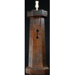 Treen - an oak novelty money box, as a Gothic castle keep, turned bone finial, push-fitting cover,