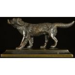 A 19th century brown patinated bronze desk weight, cast as a retreiver dog, spreading rectangular