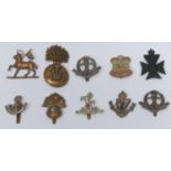 Ten WWI and WWII British Army cap badges