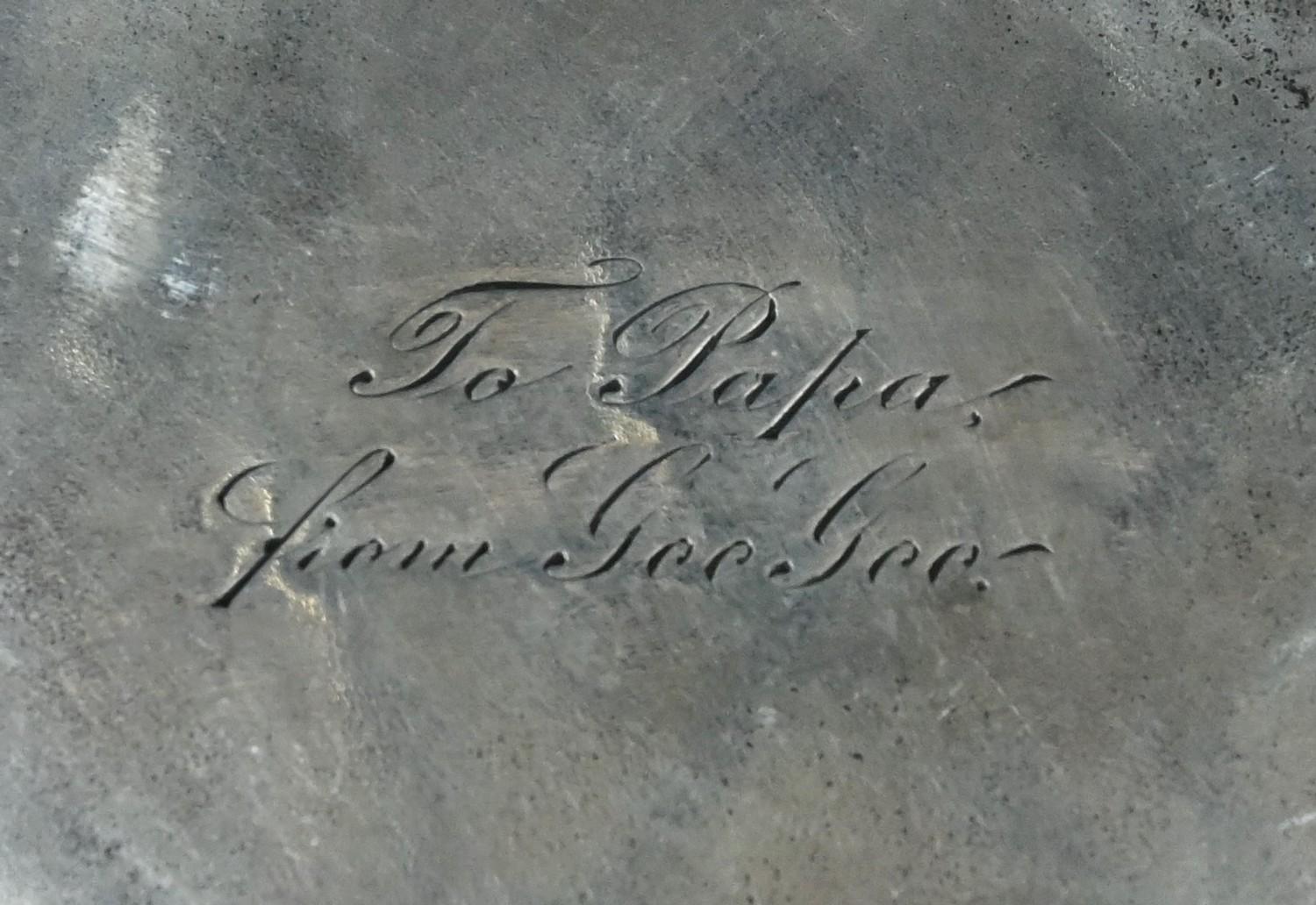 A 19th century Continental silver easel pocket watch stand, pierced and die-stamped with winged - Image 2 of 2