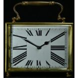 An early 20th century brass rectangular desk carriage clock, 8.5cm rectangular enamel dial inscribed