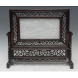 A Chinese pale jade and hardwood table screen, the rectangular panel carved in high relief with a