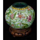 A Chinese Peking glass lobed ovoid water pot, brightly decorated with scrolling flowers on a