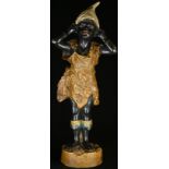 An Austrian cold painted terracotta figure, of a young black girl, 29.5cm high, c.1900