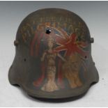 A WWI Imperial German M16 Stahlhelm with a post war paint denoting a battlefield pilgrimage in 1928