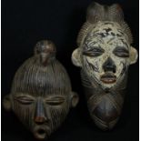 Tribal Art - a Baule terracotta mask, elaborate coiffure, scarified features, picked out in white