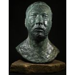 Modern British School, a verdigris patinated bronze, portrait of a young man, signed in the maquette