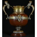 A 19th century gilt bronze mounted red marble mantel vase, each figural scroll handle as a female
