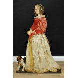 A 19th century style polychrome dummy board, depicting a young lady and a dog, 123cm high