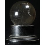 Mysticism - a miniature 'crystal ball', ebonised stand, 7cm high