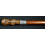 A gentleman's novelty walking cane, the pommel carved as a portrait bust of David Lloyd George,