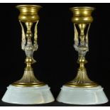 A pair of 19th century French gilt bronze candlesticks, each as a bird, white onyx bases, 13cm high,