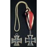 A World War II Third Reich Nazi German Iron Cross, marked 1939 and with swastika; another (2)