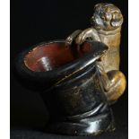 An Austrian cold painted terracotta novelty table vesta, as a pug peering into a top hat, 9.5cm