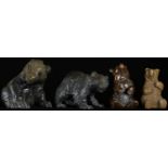 A Black Forest carving, of a bear cub, seated, 7cm high, early 20th century; others (4)