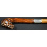A gentleman's novelty walking cane, the handle carved as the head of a horse, silver ferrule,