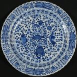 A Chinese shaped circular charger, painted in underglaze blue, the centre with five fish on a