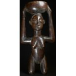 Tribal Art - a Luba Caryatid figure cup, depicted kneeling, an open bowl on her head, 26.5cm high,