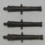 Antiquities - a set of three 17th century verdigris patinated bronze novelty toy cannons, of typical