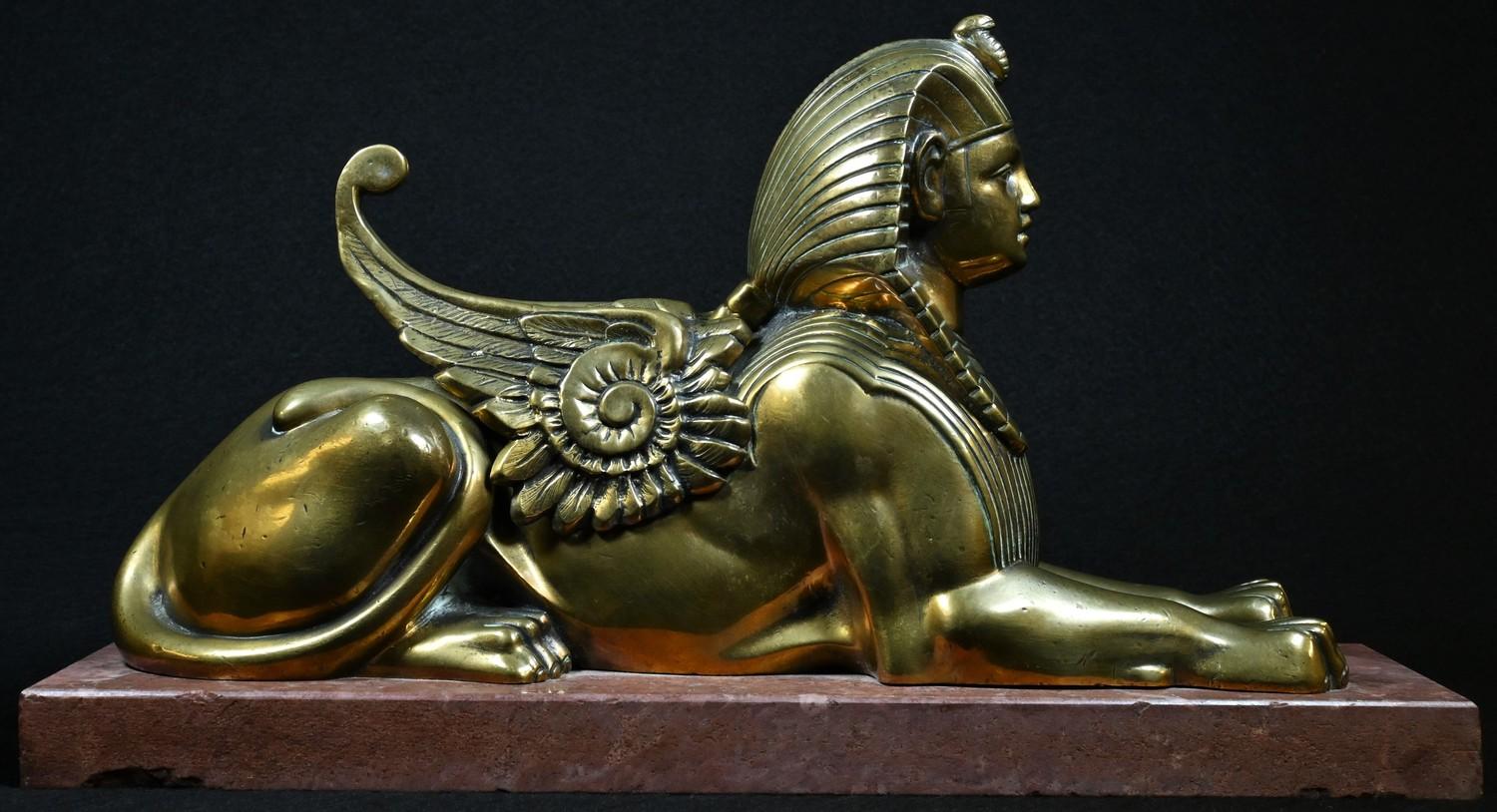 French Egyptian Revival School (19th century), a bronze, of a sphinx, rectangular marble base,