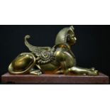 French Egyptian Revival School (19th century), a bronze, of a sphinx, rectangular marble base,