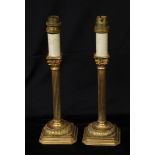 A pair of gilt bronze Corinthian column table lamps, 29.5cm high, early to mid-20th century